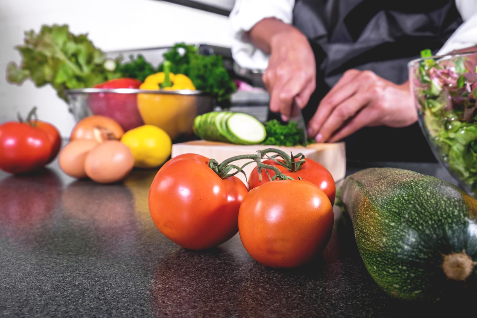 Workshop kitchen with tools and fresh produce on counter